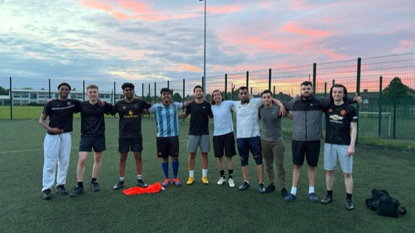 Players lined up under a sunset at a Dublin pitch